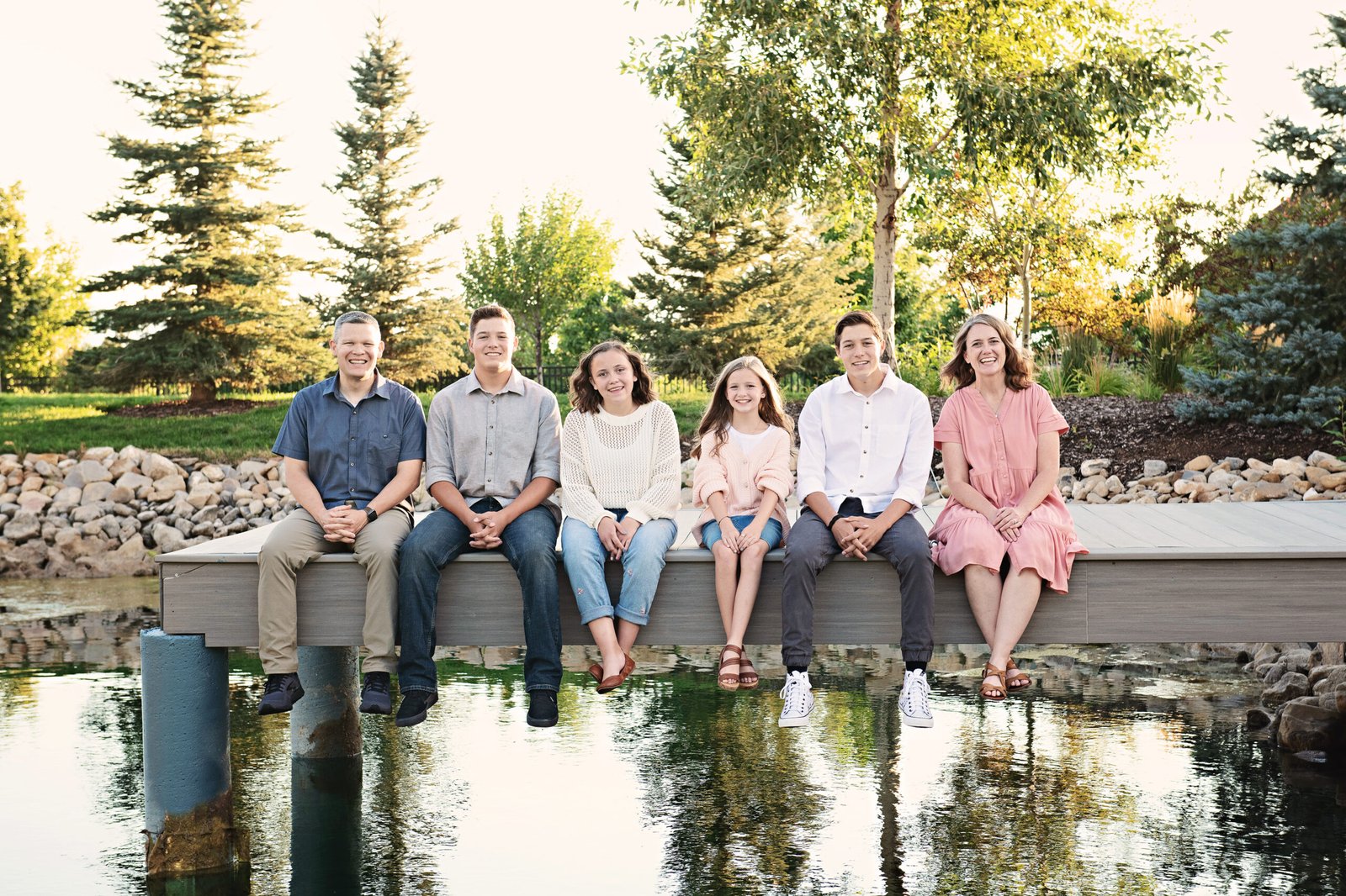 Utah Family Picture of family sitting on a dock